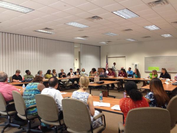 IIAC members gathered around tables for a monthly meeting at Immokalee Community Park